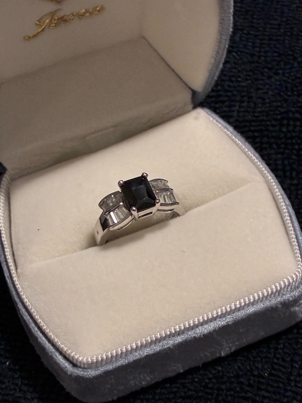 Silvertone Black Stone Ring with Baguette Accents